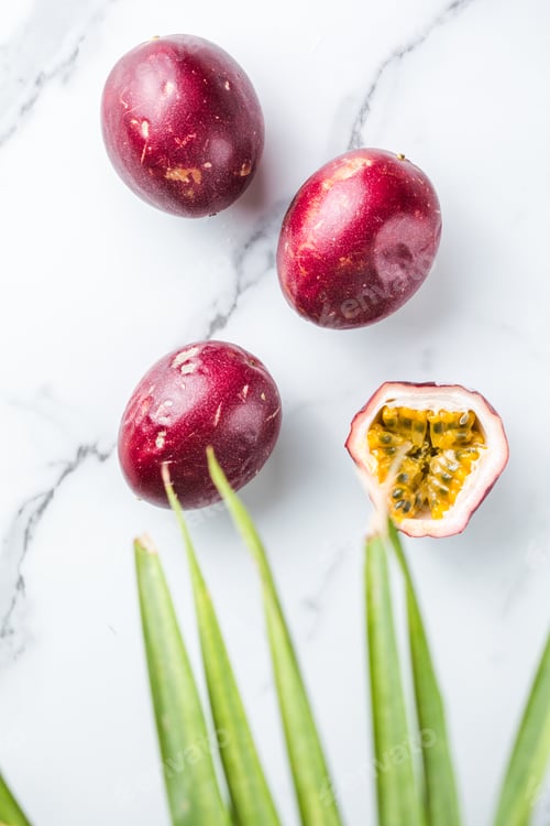 Preview: Ripe passion fruit, half and slice of fruit on a white background.