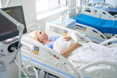 Preview: Middle-aged woman lies on a special hospital bed