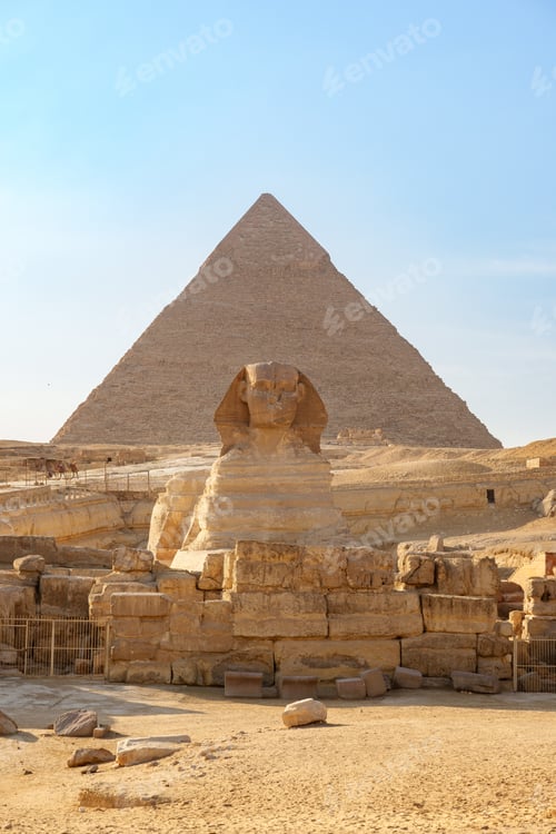 Preview: Sphinx stands guard in front of the Great Pyramid at Giza during a clear afternoon