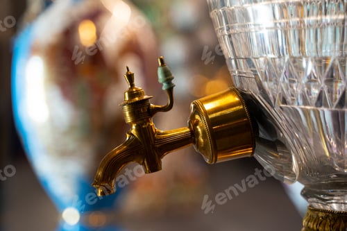 Preview: closeup of gold plated spigot of glass samovar