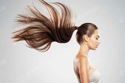 Preview: Profile portrait of a beautiful woman with a long straight hair.