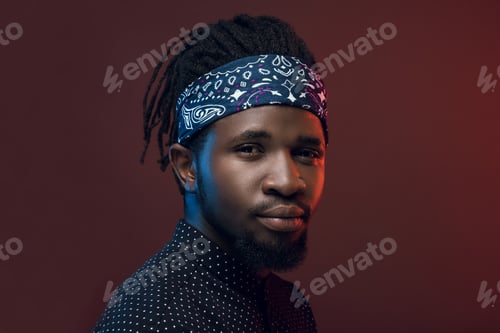 Preview: portrait of handsome african american man isolated on burgundy