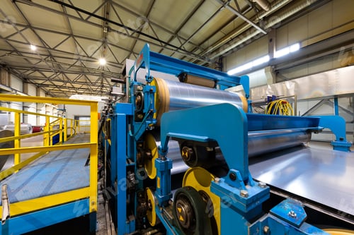 Preview: Photo of steel roofing forming machine. Industrial machine for metal sheet roof coils cut. Process