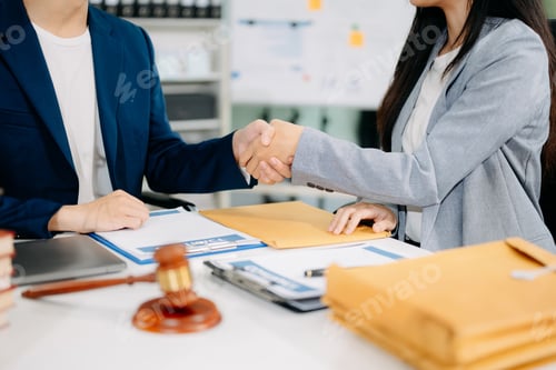 Preview: Woman lawyer hand and women client shaking hand collaborate on working agreements