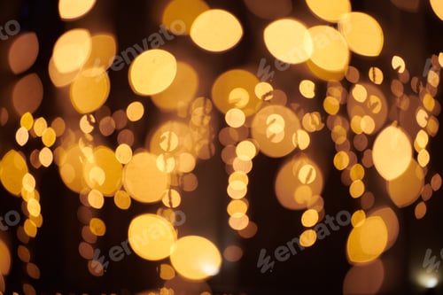 Preview: Yellow lights bokeh from christmas holiday garlands, blurred festive background, abstract lights