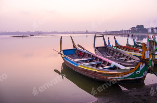 Preview: Sunrise scene with boat at lake at Ubeng bridge,Mandalay,Myanmar