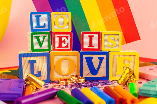 Preview: LGBT concept, text love, LGBT flag. Close up.