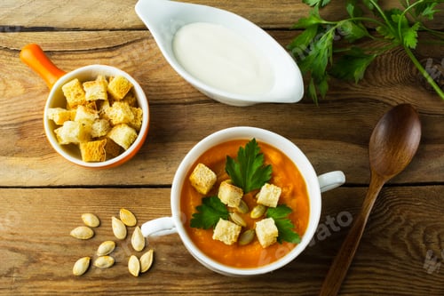 Preview: Pumpkin soup with croutons in the white bowl