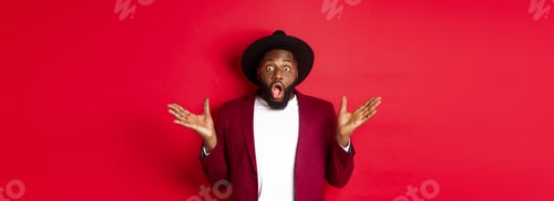 Preview: Fashion and party concept. Impressed Black man in classy outfit staring with complete disbelief at