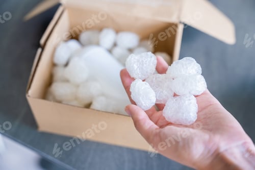 Preview: Eco packaging of parcels and white biodegradable filler. Box is filled with a filler safety for