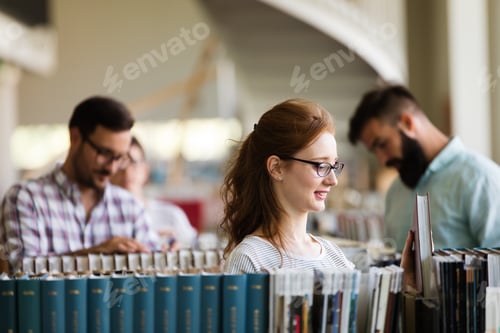 Preview: Group of happy young college students studying