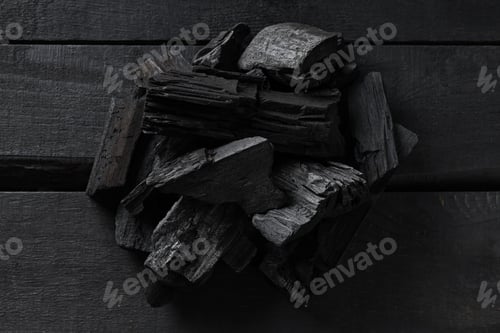 Preview: Natural wood or hardwood charcoal on wooden table