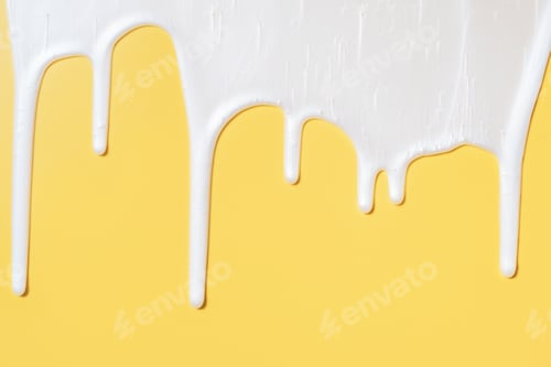 Preview: liquid moisturizing shampoo dripping down on yellow background close-up.
