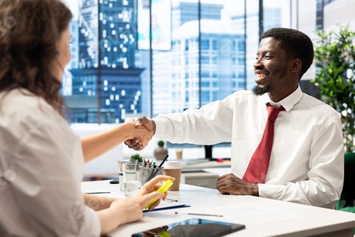Preview: Stakeholders meeting in office, doing congratulating handshake gesture