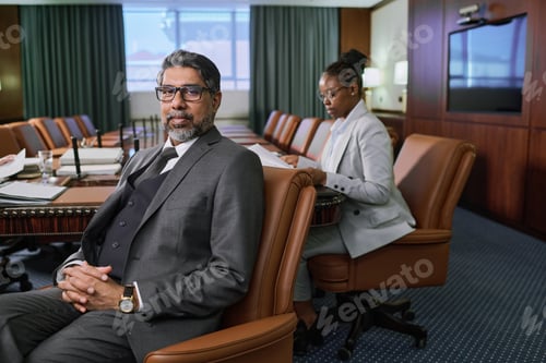 Preview: Confident male director in grey suit