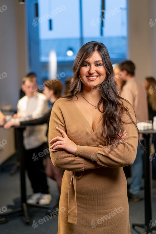 Preview: portrait of a young girl at a business conference during a coffee break working networking