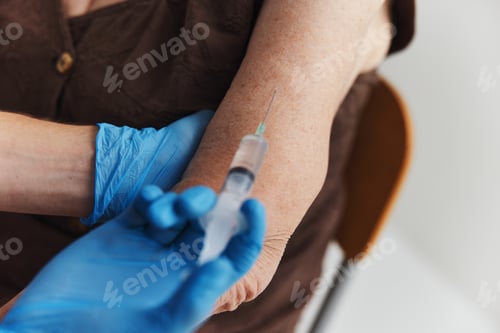 Preview: a shot in a woman's hand vaccination covid-19 passport