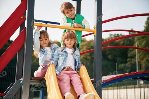 Preview: Beautiful sunlight. Kids are having fun on the playground