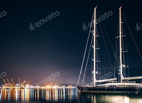 Preview: Luxury yacht in La Spezia at night with reflection in water