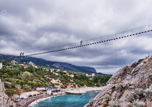 Preview: Suspension bridge to Diva rock, Black Sea coast, near Yalta, Crimea. Panorama of the town of Simeiz