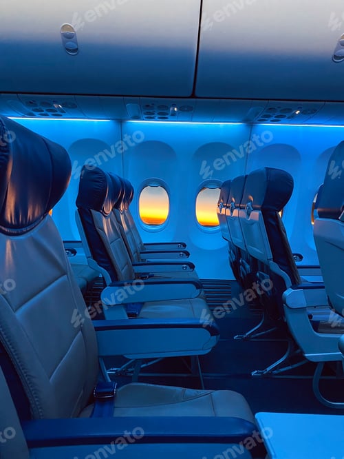 Preview: Interior of an airplane cabin with blue leather seats