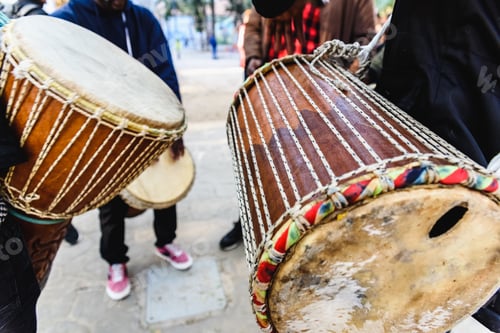 Preview: African drummers blowing their bongos on the street.