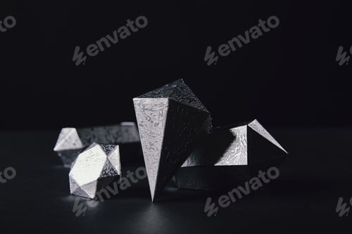 Preview: close-up view of shiny faceted silver pieces on black