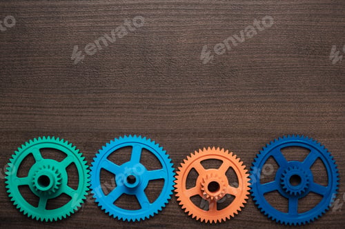 Preview: Colorful Gears On The Wooden Background