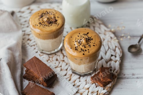 Preview: Glass of Iced Dalgona Coffee, trendy fluffy creamy whipped coffee and milk