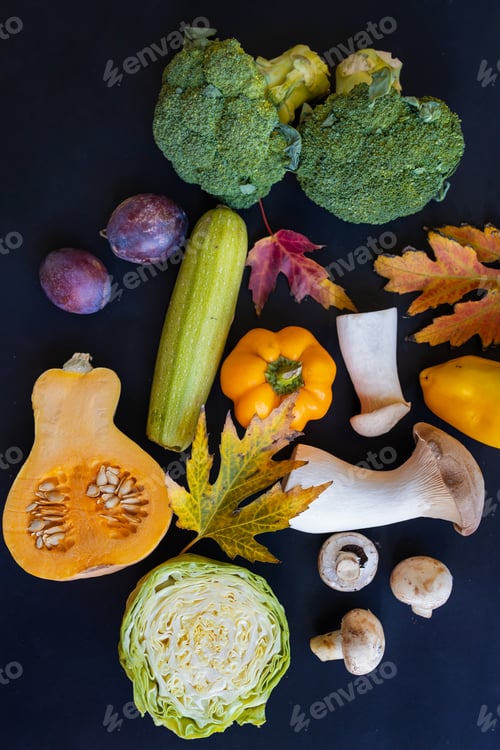 Preview: Raw vegetables background. Healthy organic food. pepper, mushroom, cabbage, broccoli and pumpkin on