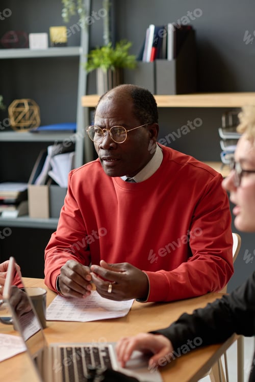 Preview: African businessman sitting at meeting