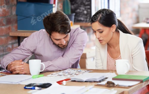 Preview: Working hard to ensure business success. Young creative professionals working in an office.