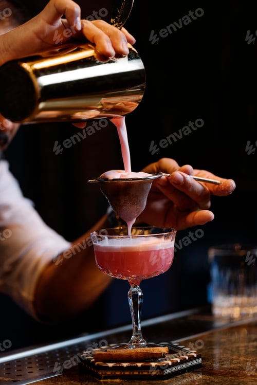 Preview: Barman is making cocktail at night club.