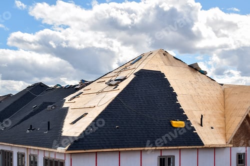 Preview: The process of installation of black roof shingles on new residential home