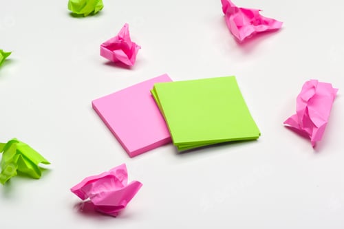 Preview: crumpled paper on white table brainstorming in the office concept