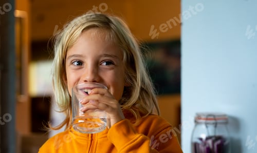 Preview: Boy with a glass of water laughing
