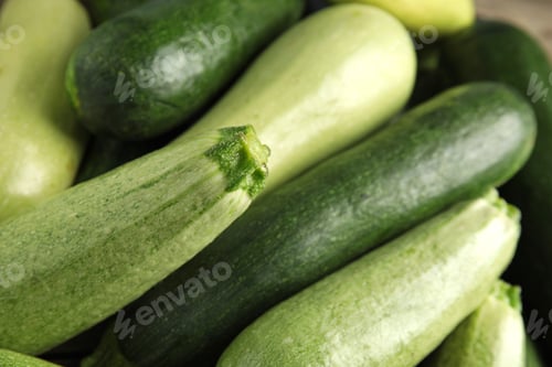 Preview: Top view of fresh ripe zucchini as background, closeup
