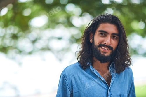 Preview: Enjoying some fresh air. Portrait of a smiling young man outside on a sunny day.