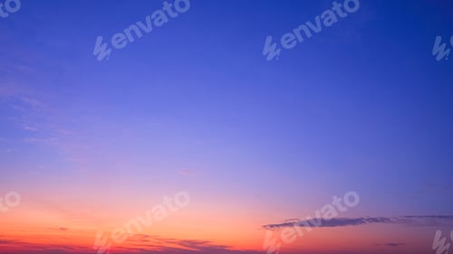 Preview: Sunset sky background in the evening with nature light and cloud on orange and blue dusk sky
