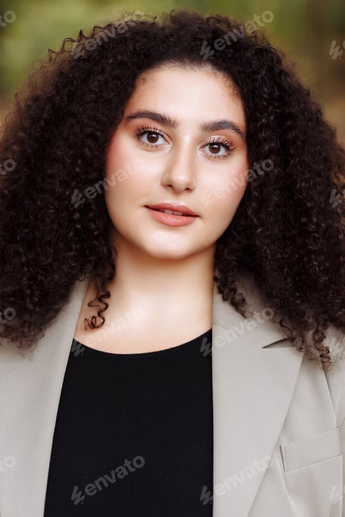 Preview: Beautiful Woman with Curly Hair Wearing Blazer