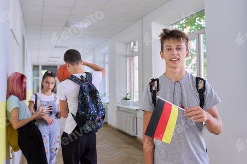 Preview: Student teenager male with the flag of Germany inside school, school