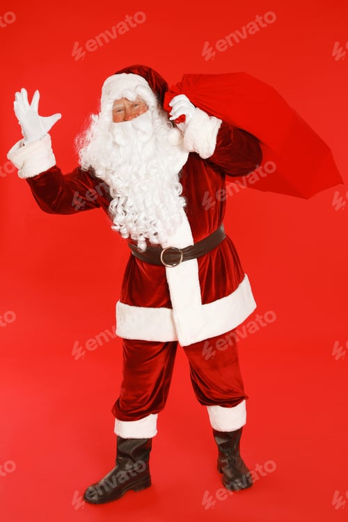 Preview: Authentic Santa Claus with bag full of gifts on red background