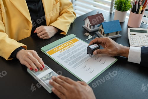 Preview: the buyer or renter is placing a deposit money with the real estate agent after signing