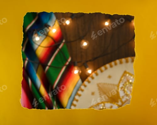 Preview: Torn paper frame in front of festive mexican background. Cinco de mayo celebration.