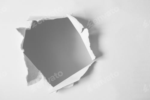 Preview: Round open hole in white paper with copy space. Torn ripped paper sheet with selective focus