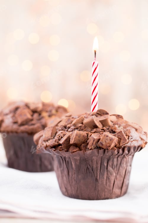 Preview: Homemade chocolate muffins on the vintage background.