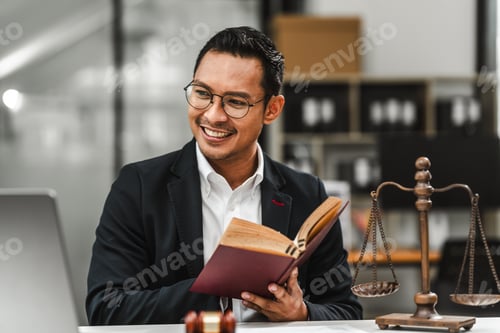 Preview: Handsome businessman lawyer of Indian descent. trusted litigation lawyers attorneys.