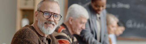 Preview: Header of Senior Caucasian Man Smiling during Adult Education Class