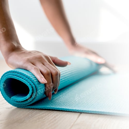 Preview: Rolling up Yoga Mat on Wooden Floor
