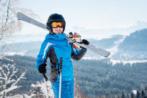 Preview: Skier resting on top of the mountain